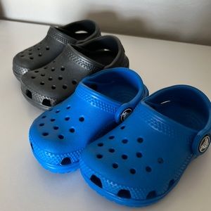 Infant Crocs. Two pair, black and blue. Size 4